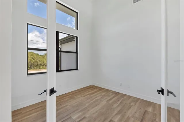 a view of an empty room with a window