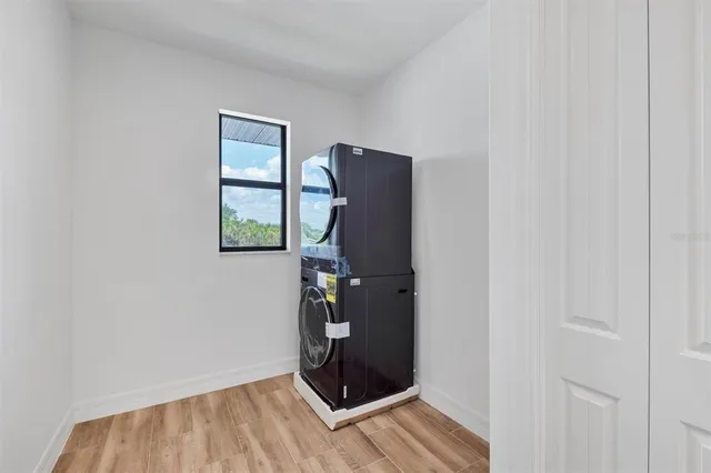 a view of an entryway with wooden floor