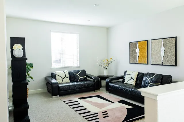 a living room with furniture and a window