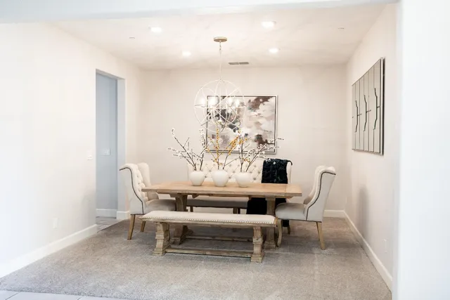 a dining room with furniture and window