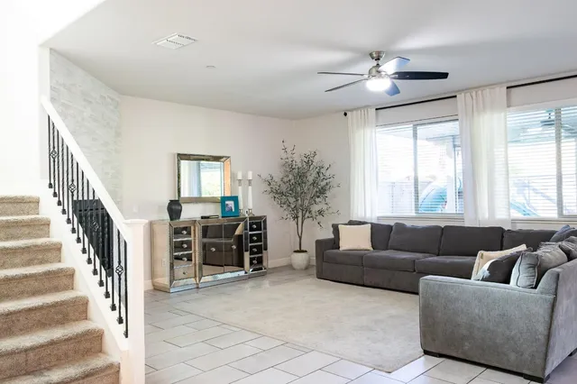 a living room with furniture and a window
