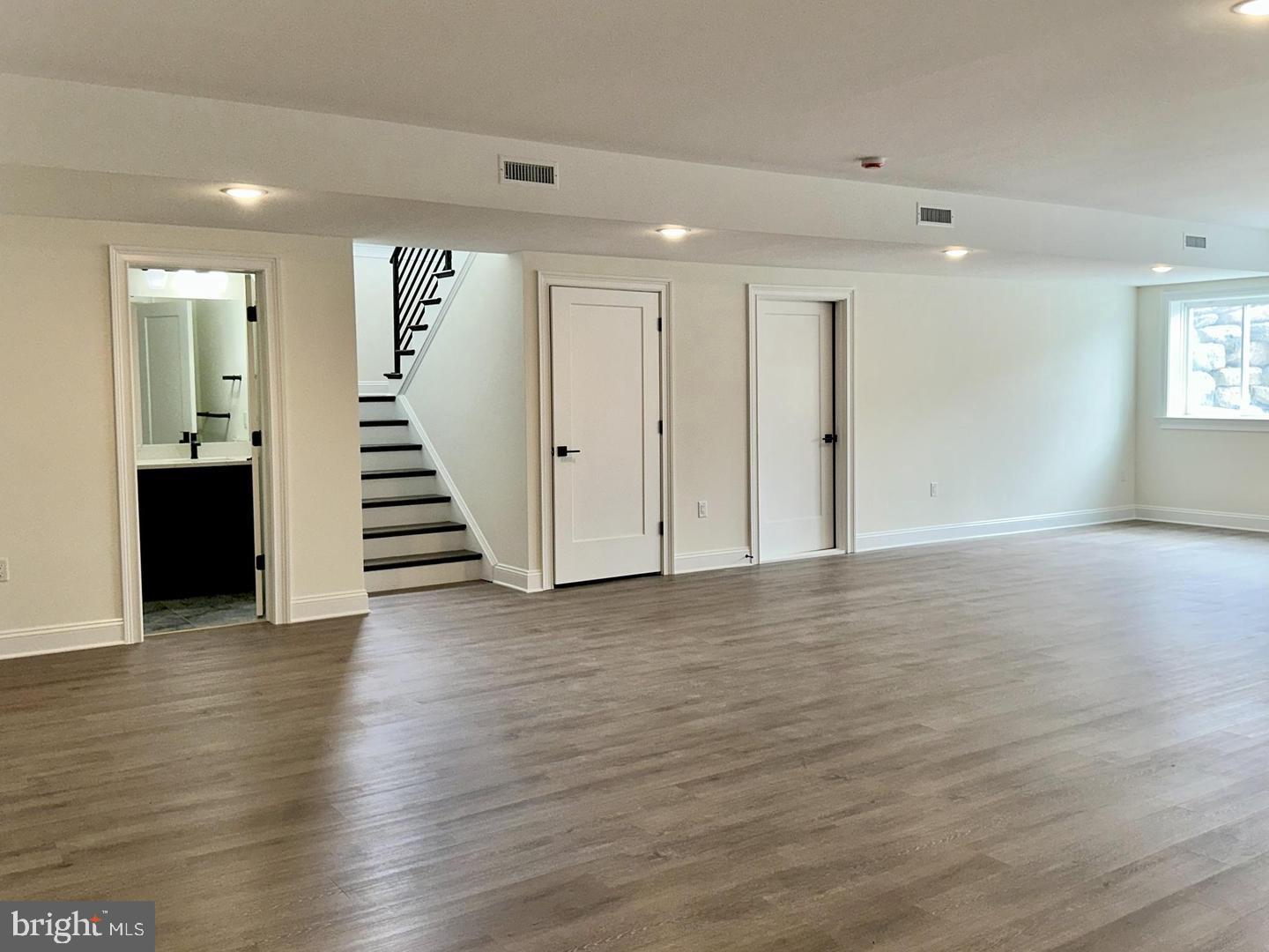 376 Spring Haven Drive Lancaster, PA 17601 - Photo 2 of 33 a view of a room with wooden floor and stairs