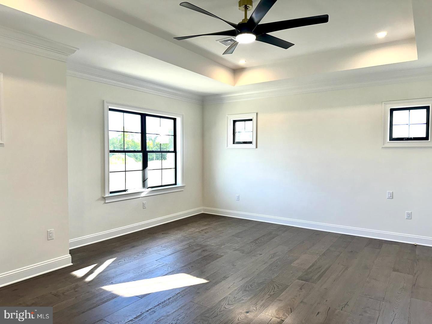 376 Spring Haven Drive Lancaster, PA 17601 - Photo 4 of 33 an empty room with wooden floor fan and windows