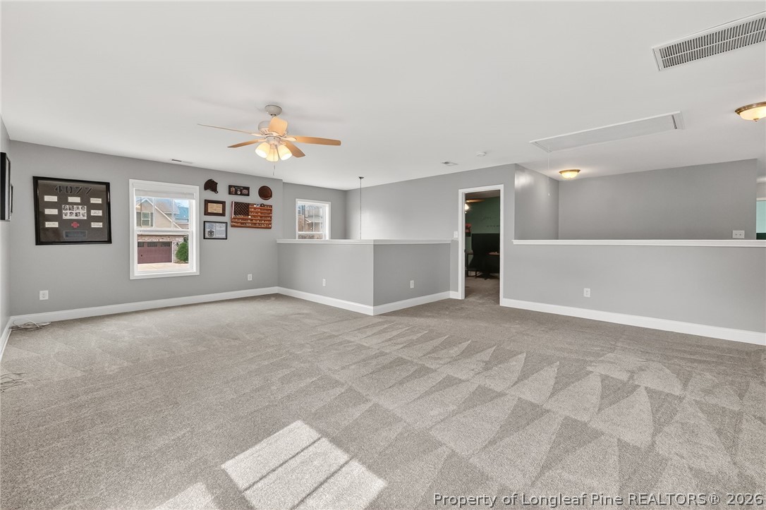 5129 Carson Allen Road Hope Mills, NC 28348 - Photo 25 of 50 wooden floor in an empty room with a window