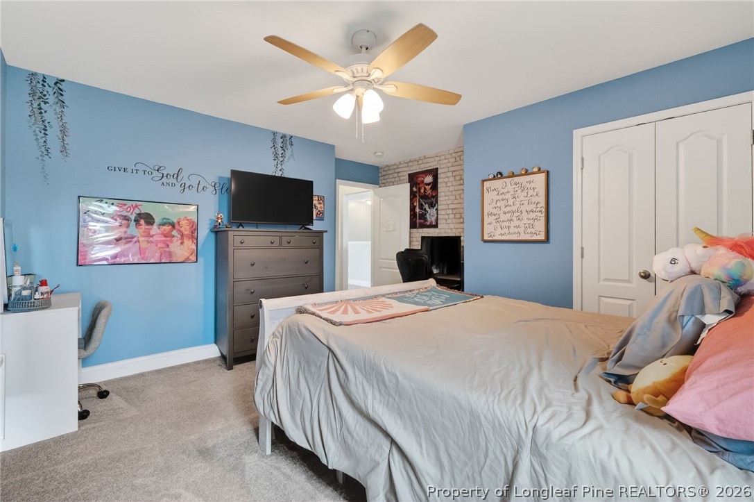 5129 Carson Allen Road Hope Mills, NC 28348 - Photo 28 of 50 a bedroom with a bed and a flat screen tv