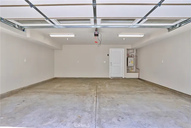 an outdoor space with patio and white umbrellas