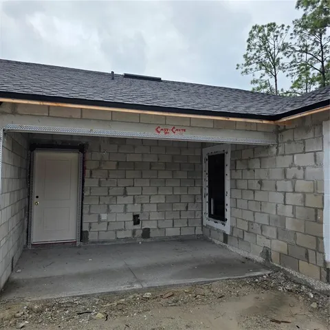a backyard of a house with lots of green space
