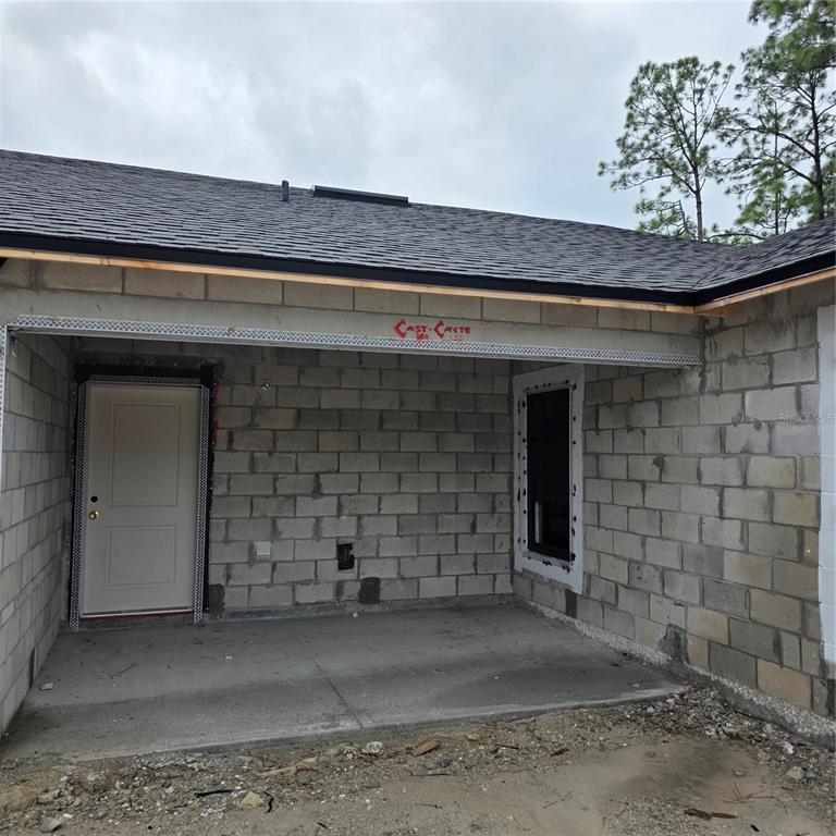1659 Javier Street, Unit A Palm Bay, FL 32909 - Photo 3 of 6 a front view of a house with a yard