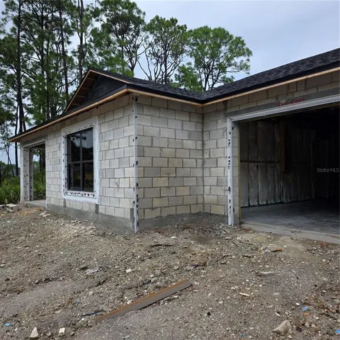 a front view of a house with parking