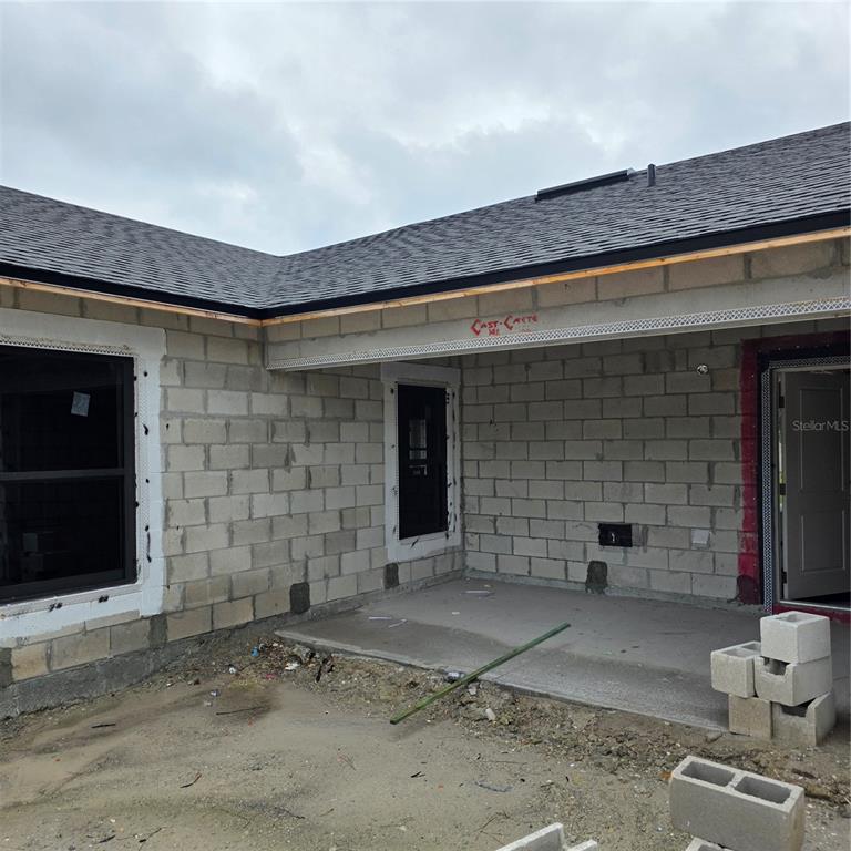 1659 Javier Street, Unit A Palm Bay, FL 32909 - Photo 5 of 6 a front view of a house with parking