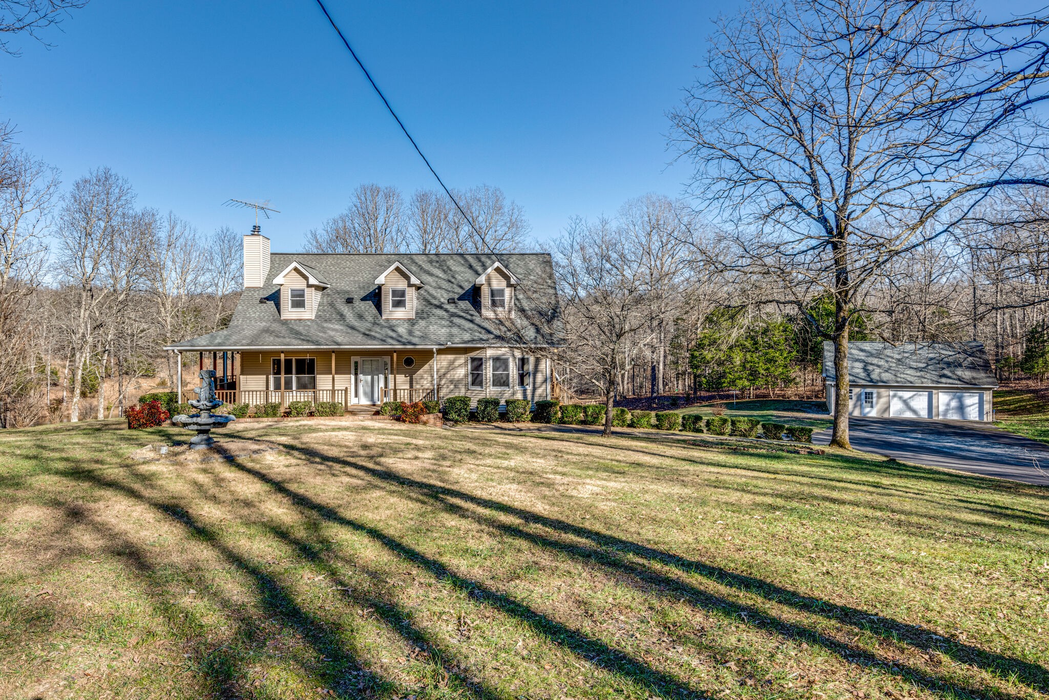 851 Roy Donegan Road Dickson, TN 37055 - Photo 8 of 51 a view of a big house with a big yard and large trees
