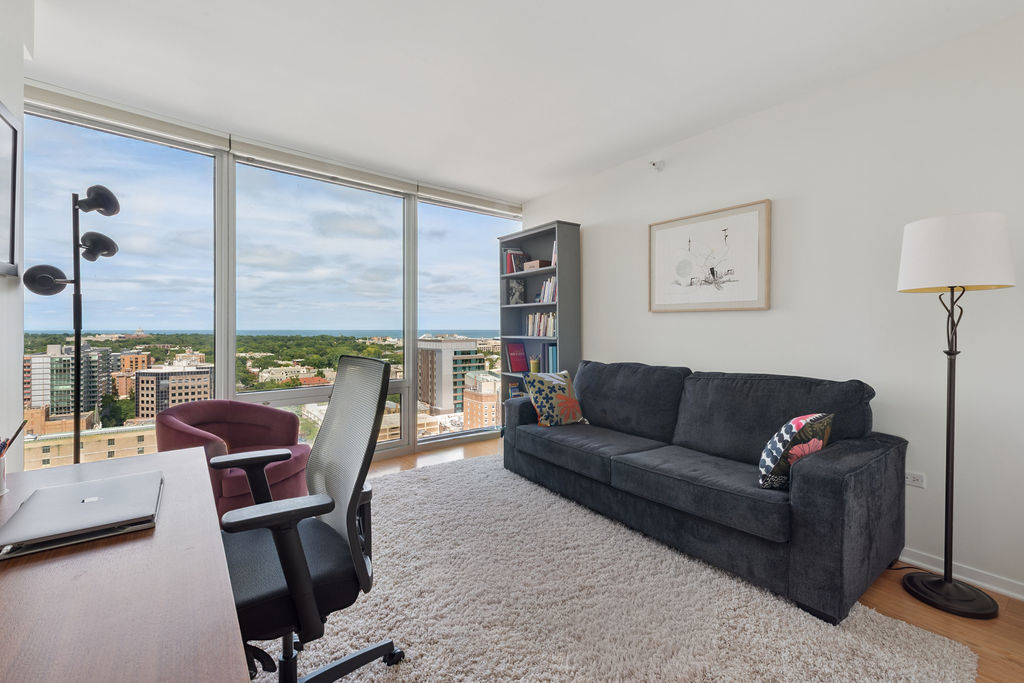807 Davis Street, Unit 1907 Evanston, IL 60201 - Photo 13 of 20 a living room with furniture and a large window