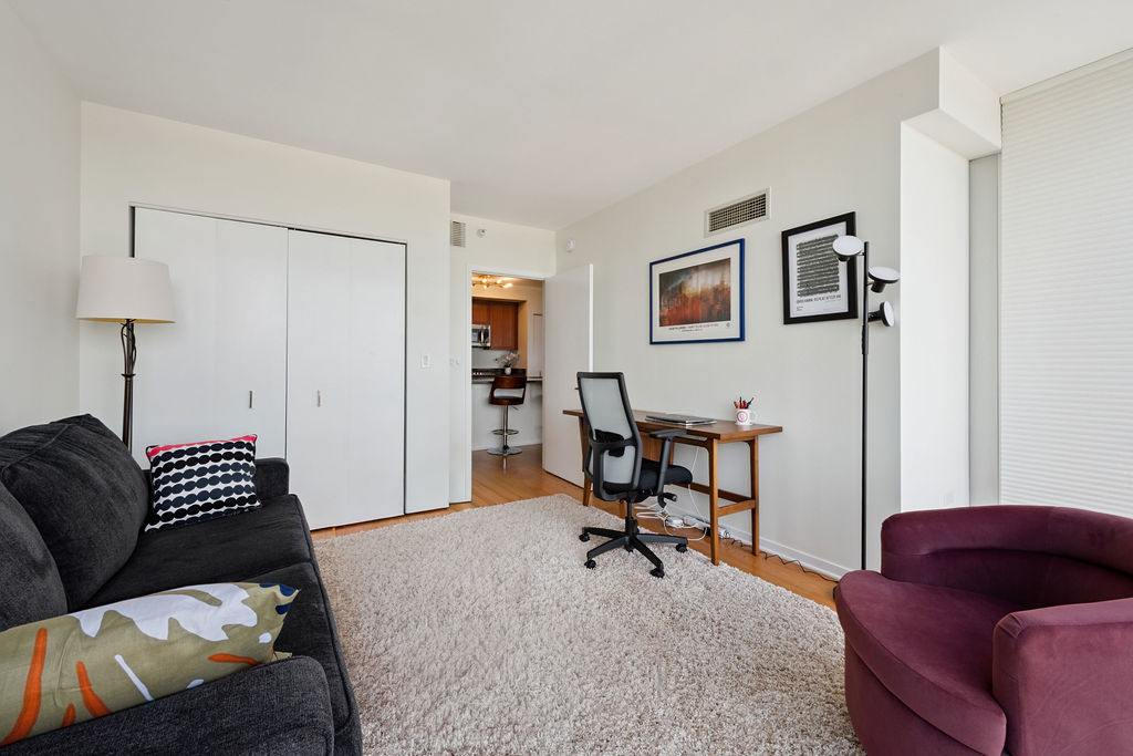 807 Davis Street, Unit 1907 Evanston, IL 60201 - Photo 14 of 20 a living room with furniture and a couch
