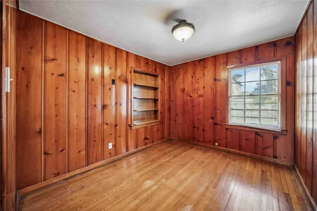 a view of a wooden floor with entryway