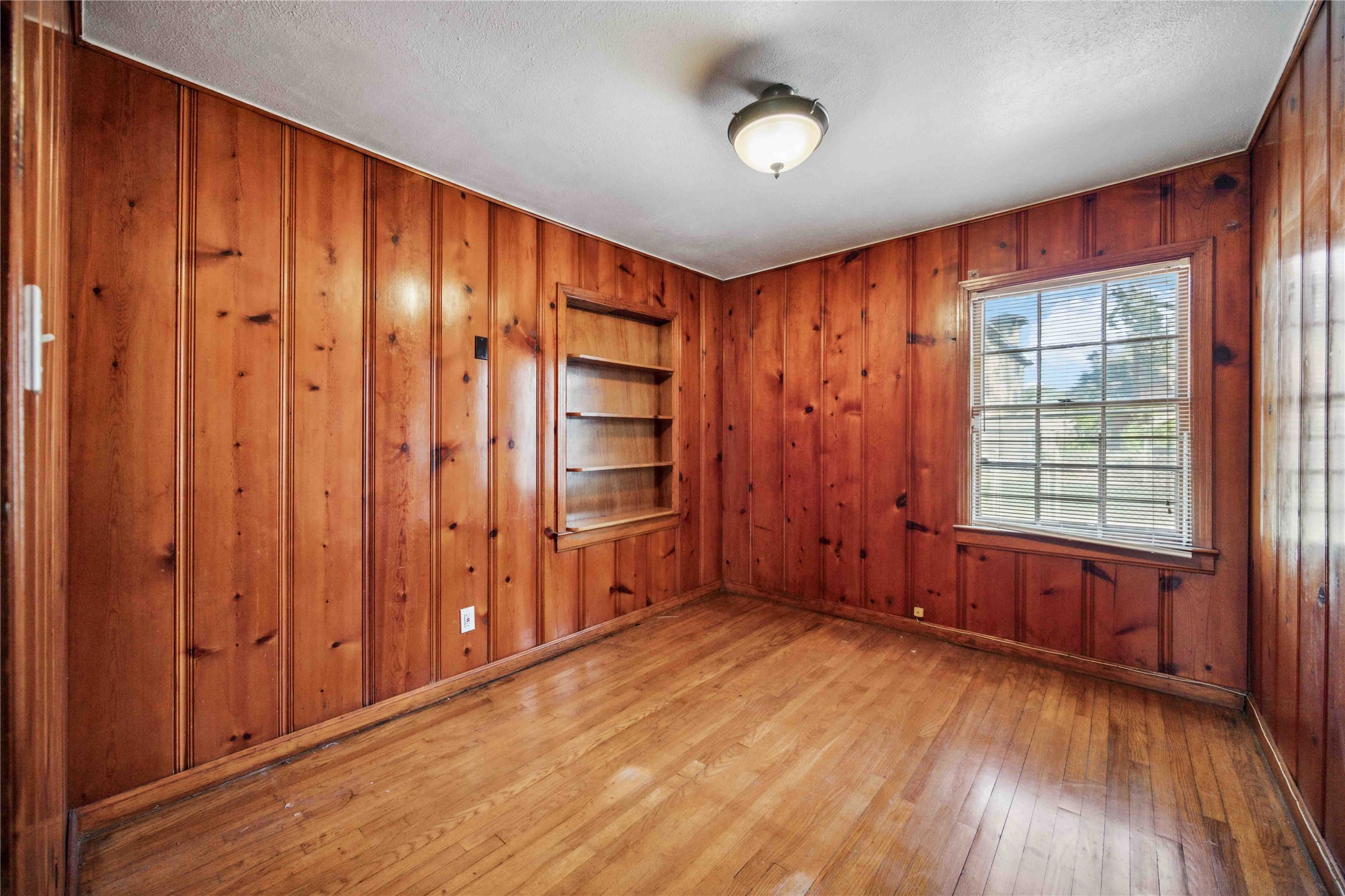 3729 Griggs Road Houston, TX 77021 - Photo 18 of 26 an empty room with wooden floor and windows