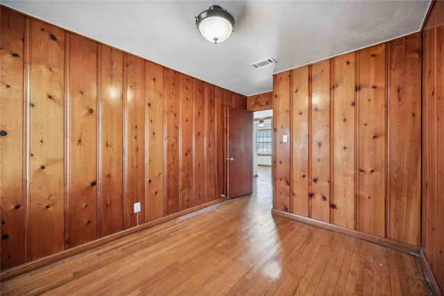 a view of storage and utility room with a window