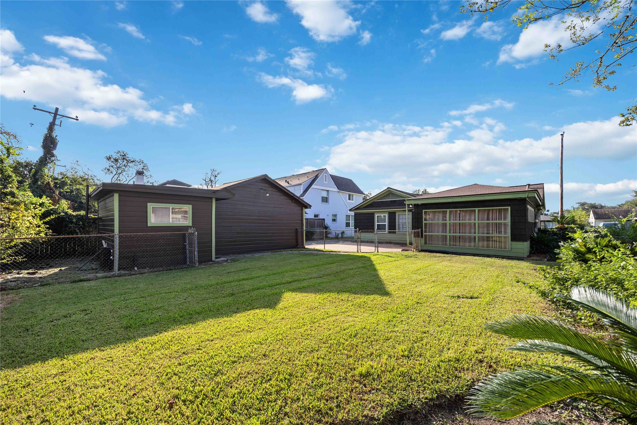 3729 Griggs Road Houston, TX 77021 - Photo 25 of 26 a front view of a house with a garden