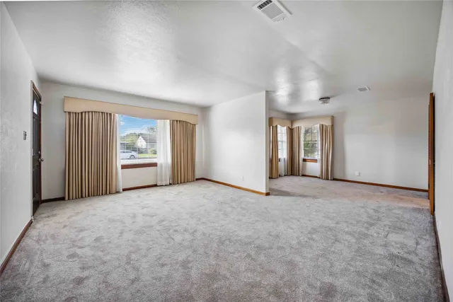 an empty room with windows