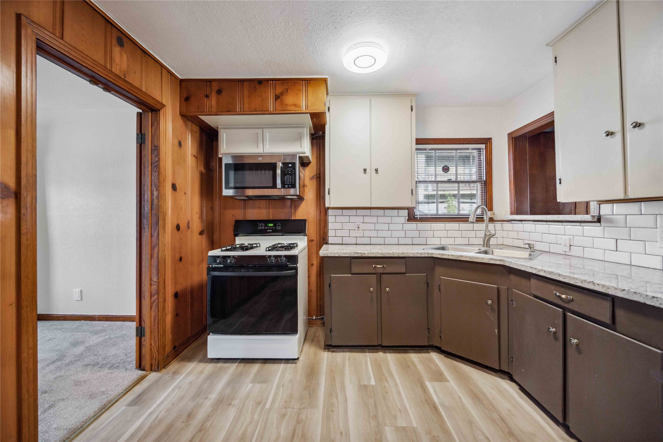 3729 Griggs Road Houston, TX 77021 - Photo 9 of 26 a kitchen with a sink and a stove top oven