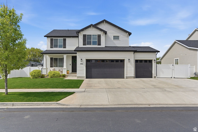 596 South Meade Street Mapleton, UT 84664 - Photo 1 of 38 View of front of home with a gate, a porch, driveway, and a garage