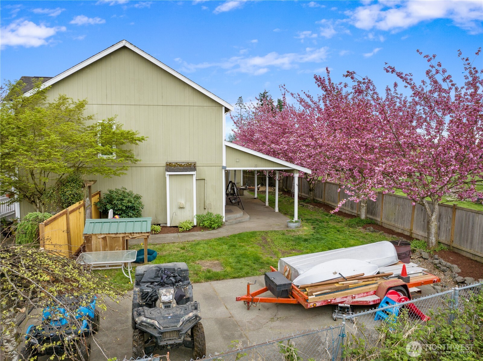 263 Hamilton Court Buckley, WA 98321 - Photo 30 of 35 a view of backyard of house with outdoor seating and green space