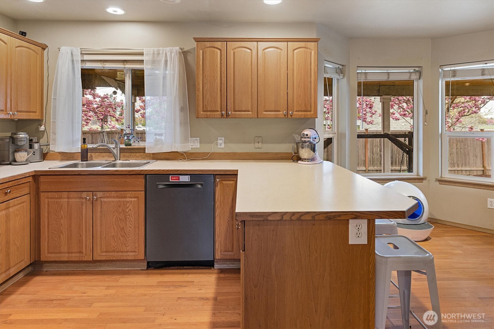 263 Hamilton Court Buckley, WA 98321 - Photo 9 of 35 a kitchen with a sink cabinets and window