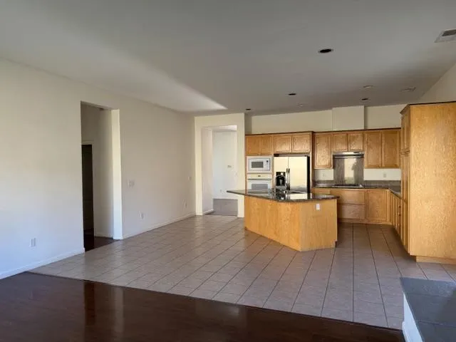 a kitchen with counter top space and appliances