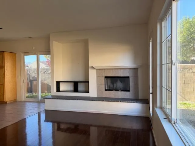 a view of hall way with furniture and fireplace