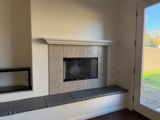 a living room with a fireplace and a table