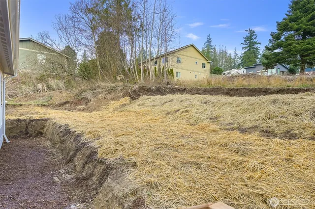 a view of house with yard