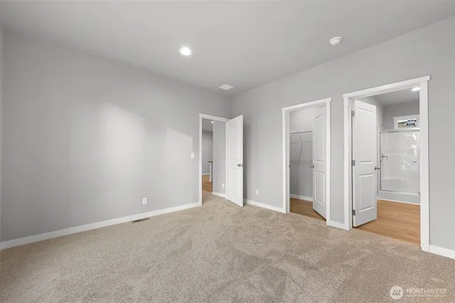 a view of an empty room and closet