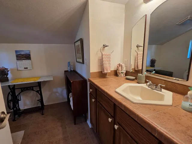 a white toilet sitting next to a bathroom sink
