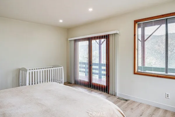 a bathroom with a sink mirror and toilet