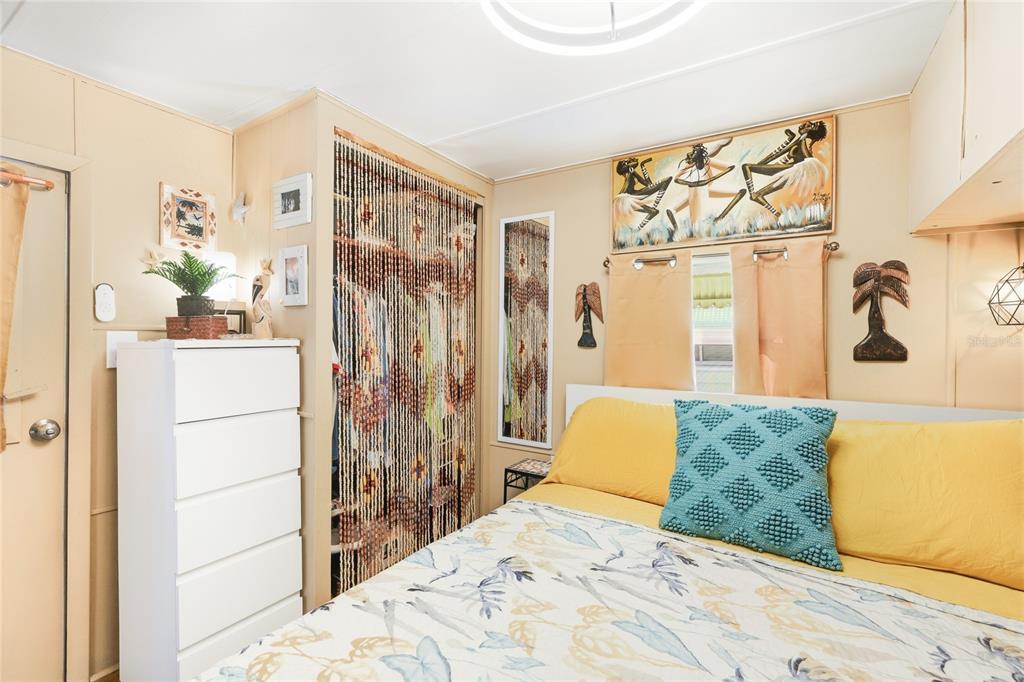 10315 Cortez Road West, Unit 142 Bradenton, FL 34210 - Photo 13 of 22 a bedroom with a bed and a dresser