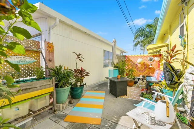a room with potted plants and painted walls