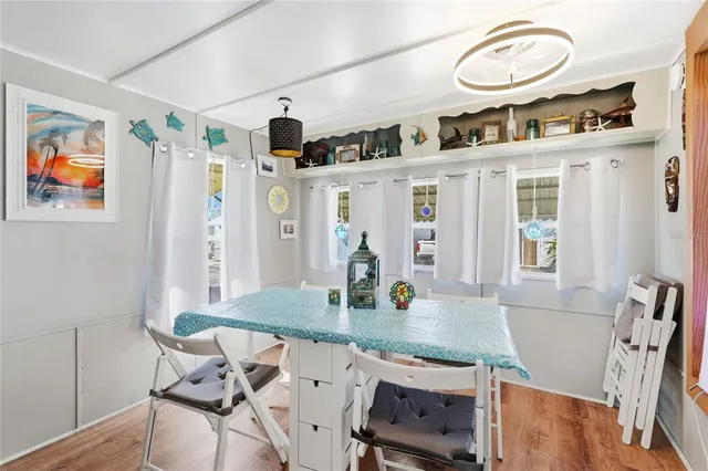 a view of a dining room with furniture window and wooden floor