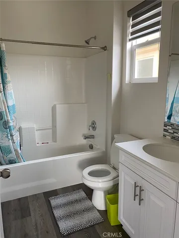 a bathroom with a sink a toilet and a bathtub