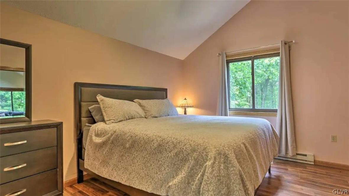 1017 Clover Road Long Pond, PA 18334 - Photo 16 of 45 a large bed sitting in a bedroom next to a window