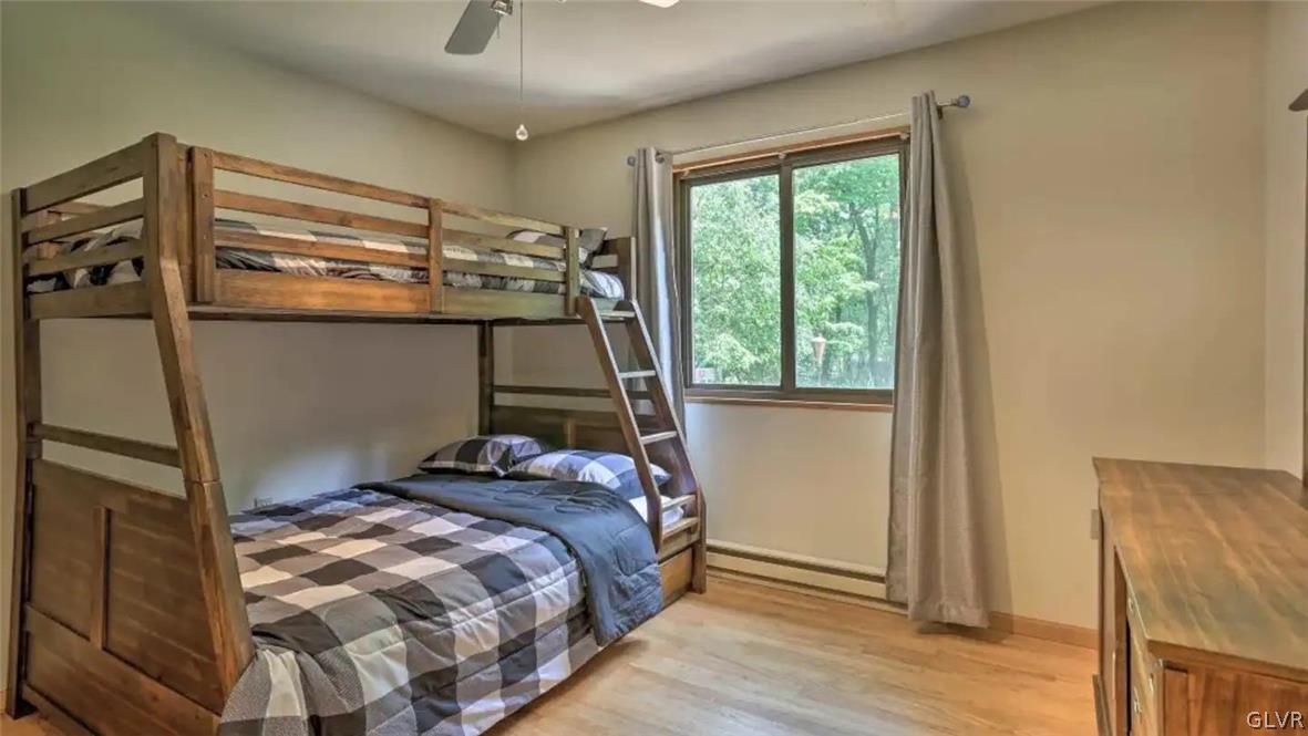 1017 Clover Road Long Pond, PA 18334 - Photo 23 of 45 a bedroom with a bed and a window