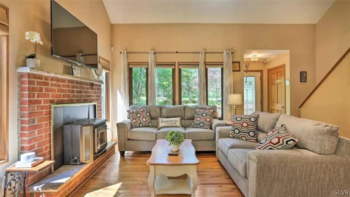 1017 Clover Road Long Pond, PA 18334 - Photo 6 of 45 a living room with furniture large windows and wooden floor