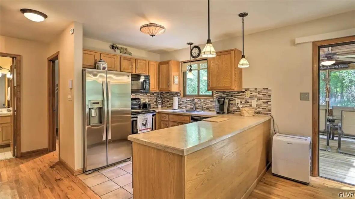 1017 Clover Road Long Pond, PA 18334 - Photo 10 of 45 a large kitchen with kitchen island granite countertop a sink a counter and stainless steel appliances