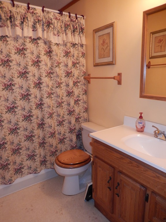 10 Hospital Road Monson, MA 01057 - Photo 7 of 17 a bathroom with a granite countertop toilet and a sink