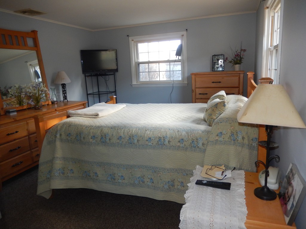 10 Hospital Road Monson, MA 01057 - Photo 8 of 17 a bedroom with a bed and wooden floor