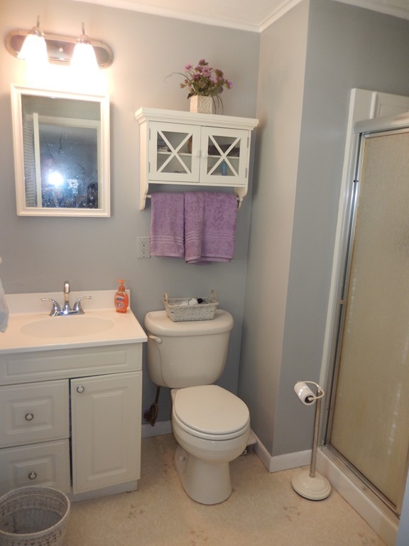10 Hospital Road Monson, MA 01057 - Photo 9 of 17 a bathroom with a toilet sink and mirror