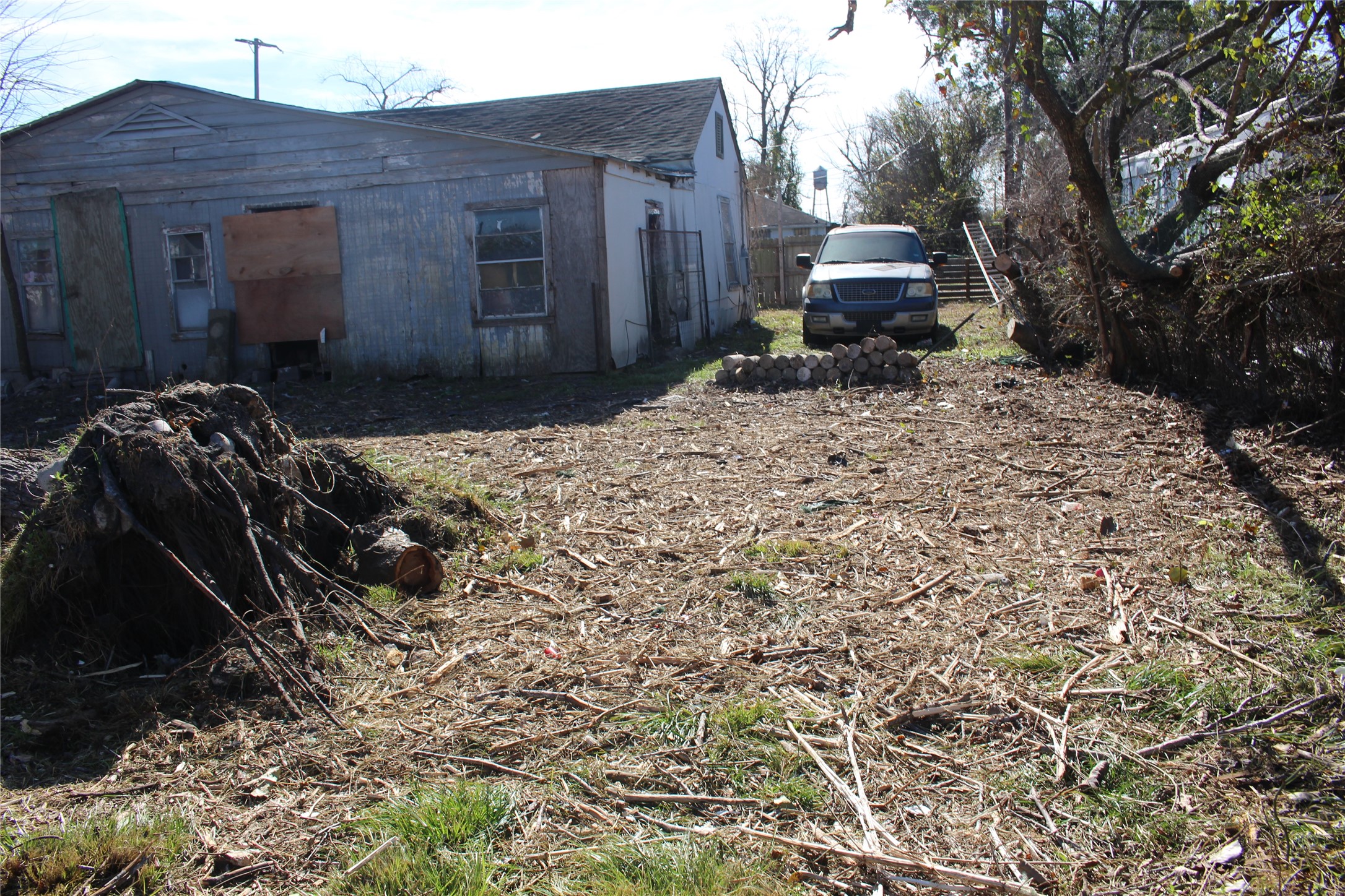 8227 Mendez Street Houston, TX 77029 - Photo 5 of 7 a front view of a house with a yard