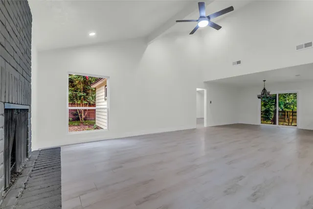 a view of a room with large windows