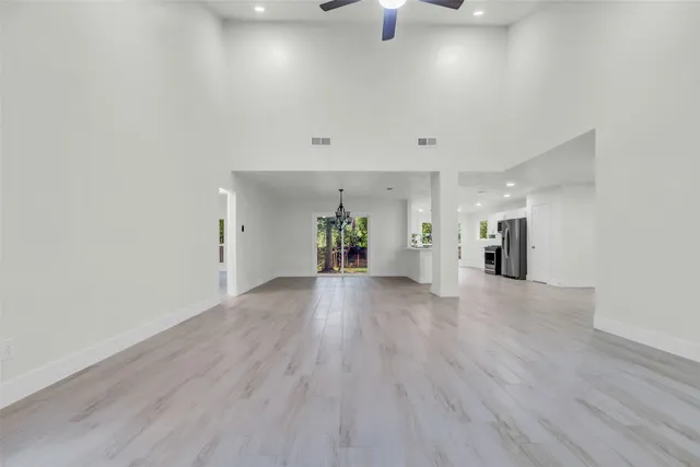 wooden floor in an empty room with a fireplace