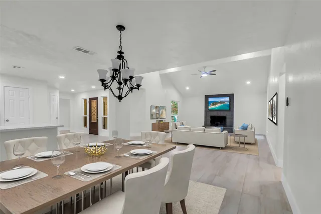 a backyard of a house with plants and large trees