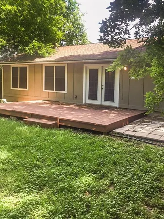 a view of house with backyard and swimming pool