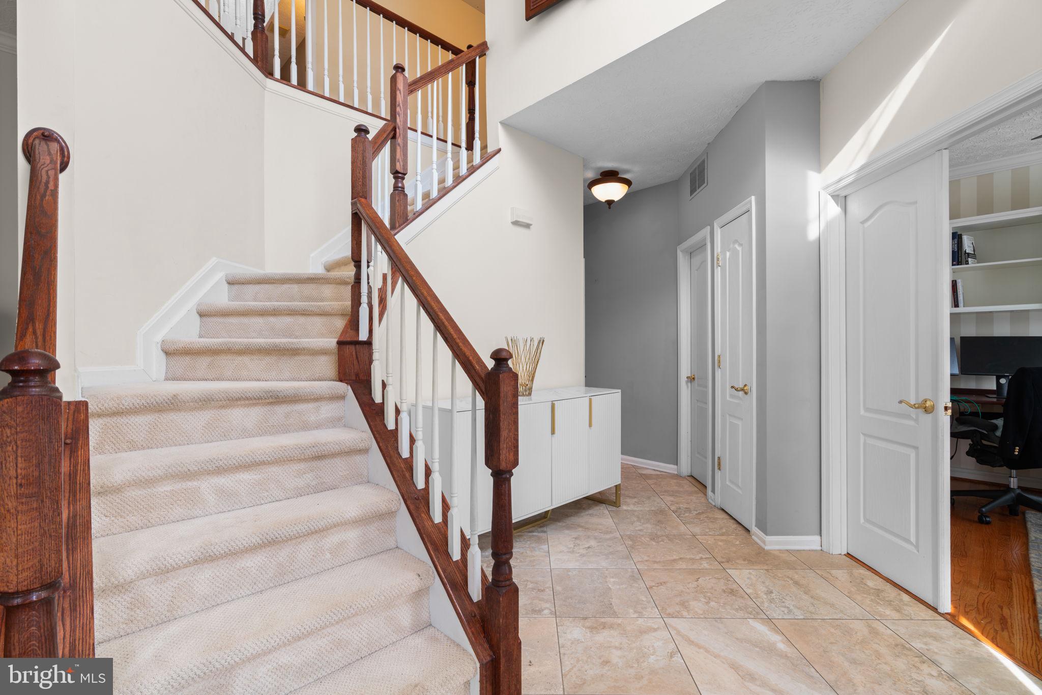 22 Dovefield Road Perry Hall, MD 21128 - Photo 19 of 46 a view of staircase with lots of frames and a rug